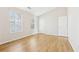 A bright bedroom features hardwood floors, and two large windows at 103 Timber Ridge Dr, Cartersville, GA 30121