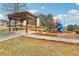 Community playground including a pergola covered picnic table, slides, and green space at 103 Timber Ridge Dr, Cartersville, GA 30121