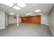 Spacious basement featuring modern flooring, brick accent wall, and open layout for versatile use at 150 Karina Pl, Canton, GA 30115
