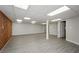 Large basement with modern vinyl floors and ample open space for flexible living at 150 Karina Pl, Canton, GA 30115