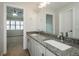 Bright bathroom with a double sink vanity and granite countertops, offering space and style at 150 Karina Pl, Canton, GA 30115