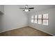 Bedroom with natural light from the large window and ceiling fan at 150 Karina Pl, Canton, GA 30115