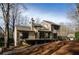 Exterior view of a house with a back deck overlooking the wooded lot at 150 Karina Pl, Canton, GA 30115