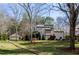 A charming home featuring a multi-car garage, manicured lawn and landscaping, and a traditional exterior design at 150 Karina Pl, Canton, GA 30115