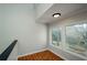 Bright landing area with tiled floors and large windows offering an inviting ambiance at 150 Karina Pl, Canton, GA 30115