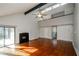 Open-concept living room features hardwood floors, fireplace, and access to the second floor at 150 Karina Pl, Canton, GA 30115