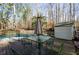 Relaxing outdoor patio featuring a dining table and chairs, perfect for enjoying nature and outdoor meals at 150 Karina Pl, Canton, GA 30115