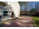 Brick patio on the rear of a home with gravel and an entrance door visible at 150 Karina Pl, Canton, GA 30115