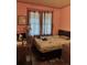 A bedroom with one window, a bed and bedside table with lamp at 1948 Mercer Ave, College Park, GA 30337