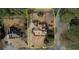 Aerial view of the property showcasing lush greenery, expansive yard, and circular driveway at 5770 Wyndemere Ln, Stone Mountain, GA 30087