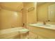 A cozy bathroom features a tub and shower combination, vanity with sink, and a mirrored wall cabinet at 5770 Wyndemere Ln, Stone Mountain, GA 30087