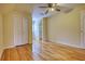 A bedroom features a double door closet, built-in shelves, and hardwood floors at 5770 Wyndemere Ln, Stone Mountain, GA 30087