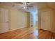 Bedroom featuring hard wood floors and two white closets at 5770 Wyndemere Ln, Stone Mountain, GA 30087