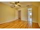 A bedroom features hardwood floors and a door to the adjoining room at 5770 Wyndemere Ln, Stone Mountain, GA 30087