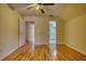 A bedroom features hardwood floors and a door to the en suite bathroom at 5770 Wyndemere Ln, Stone Mountain, GA 30087