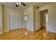 Bedroom features hardwood floors, with closet and bathroom access at 5770 Wyndemere Ln, Stone Mountain, GA 30087