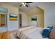 Bedroom with hardwood floors, vaulted ceiling, and decorated with wall mounted TVs at 5770 Wyndemere Ln, Stone Mountain, GA 30087