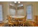 Charming breakfast nook with a round table, four chairs, and natural light at 5770 Wyndemere Ln, Stone Mountain, GA 30087