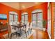 Elegant dining room with hardwood floors, arched windows, and ample natural light at 5770 Wyndemere Ln, Stone Mountain, GA 30087