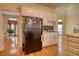 Bright kitchen features hardwood floors, white cabinets, and stainless steel appliances at 5770 Wyndemere Ln, Stone Mountain, GA 30087