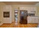 Spacious kitchen features white cabinets, hardwood floors, and stainless steel oven at 5770 Wyndemere Ln, Stone Mountain, GA 30087