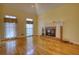 Inviting living room with hardwood floors and a classic brick fireplace at 5770 Wyndemere Ln, Stone Mountain, GA 30087