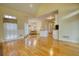 Spacious living room with hardwood floors that flows into the breakfast nook at 5770 Wyndemere Ln, Stone Mountain, GA 30087