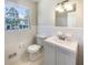 Bathroom with a new toilet, vanity, and modern fixtures at 6296 Flamingo Way, Morrow, GA 30260