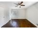 Bedroom featuring hardwood floors, a ceiling fan, and a window at 6296 Flamingo Way, Morrow, GA 30260
