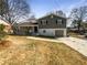 Charming two-story home with covered porch, single car garage, and beautiful yard at 6296 Flamingo Way, Morrow, GA 30260