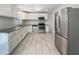 Kitchen boasting stainless appliances, granite counters and white cabinets at 6296 Flamingo Way, Morrow, GA 30260