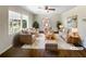 Bright and airy living room with hardwood floors, neutral paint, and abundant natural light at 6296 Flamingo Way, Morrow, GA 30260