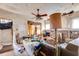 Living room featuring aged walls, hardwood floors, and a ceiling fan at 1523 Melrose Sw Dr, Atlanta, GA 30310