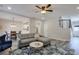 Spacious living room featuring an open floor plan, modern lighting, and elegant decor at 3606 Elkhorn Nw Ct, Duluth, GA 30096