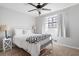 Cozy bedroom with white walls, carpet, and a ceiling fan for comfortable living at 975 Malibu Dr, Marietta, GA 30066