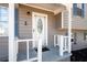 Close-up of the front porch with a white railing and decorative front door at 975 Malibu Dr, Marietta, GA 30066