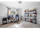 Functional home office with ample shelving, natural light, and a comfortable workspace for productivity at 975 Malibu Dr, Marietta, GA 30066