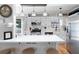 Bright kitchen with stainless steel appliances, white cabinets, and a large center island with bar stool seating at 975 Malibu Dr, Marietta, GA 30066