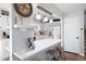 Modern kitchen with white cabinets, stainless steel appliances, and a breakfast bar at 975 Malibu Dr, Marietta, GA 30066