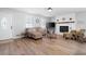 Bright and airy living room with a cozy fireplace, large window, and modern decor at 975 Malibu Dr, Marietta, GA 30066