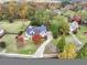 Aerial view of a beautiful home surrounded by lush landscaping and a long driveway at 102 Rosebury Dr, Canton, GA 30115