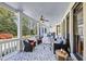 Covered back porch with seating area overlooking the yard at 102 Rosebury Dr, Canton, GA 30115