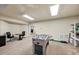Finished basement with a large game area, carpet flooring and good lighting at 102 Rosebury Dr, Canton, GA 30115
