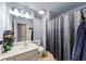 Bathroom with a modern vanity and shower with blue accent colors at 102 Rosebury Dr, Canton, GA 30115