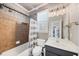 Bathroom featuring a shower-over-tub, decorative tile, and a sink with a vanity at 102 Rosebury Dr, Canton, GA 30115