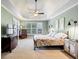 A beautiful bedroom is brightened by large windows and features a ceiling fan at 102 Rosebury Dr, Canton, GA 30115