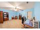 Bedroom with blue walls, carpet flooring and space for an office at 102 Rosebury Dr, Canton, GA 30115