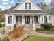 Charming front entrance featuring a covered porch and stone accents at 102 Rosebury Dr, Canton, GA 30115
