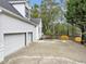 Side view of house with a spacious three car garage and parking at 102 Rosebury Dr, Canton, GA 30115