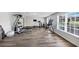 Finished gym with wood flooring, great lighting and all kinds of work out equipment at 102 Rosebury Dr, Canton, GA 30115